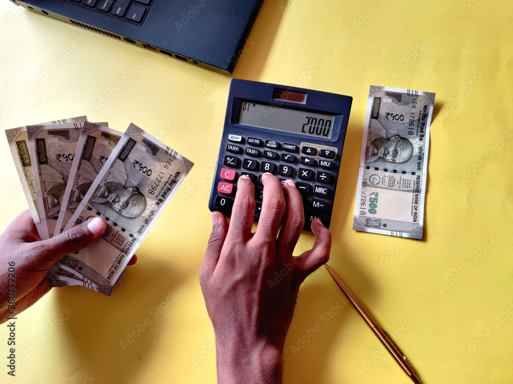 South Indian man five hundred rupees notes. Calculating bills using ...