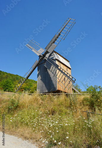Traditional old wooden windmill in Germany