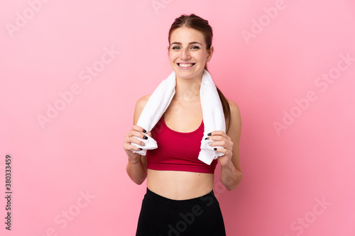 Young sport woman over isolated pink background © luismolinero