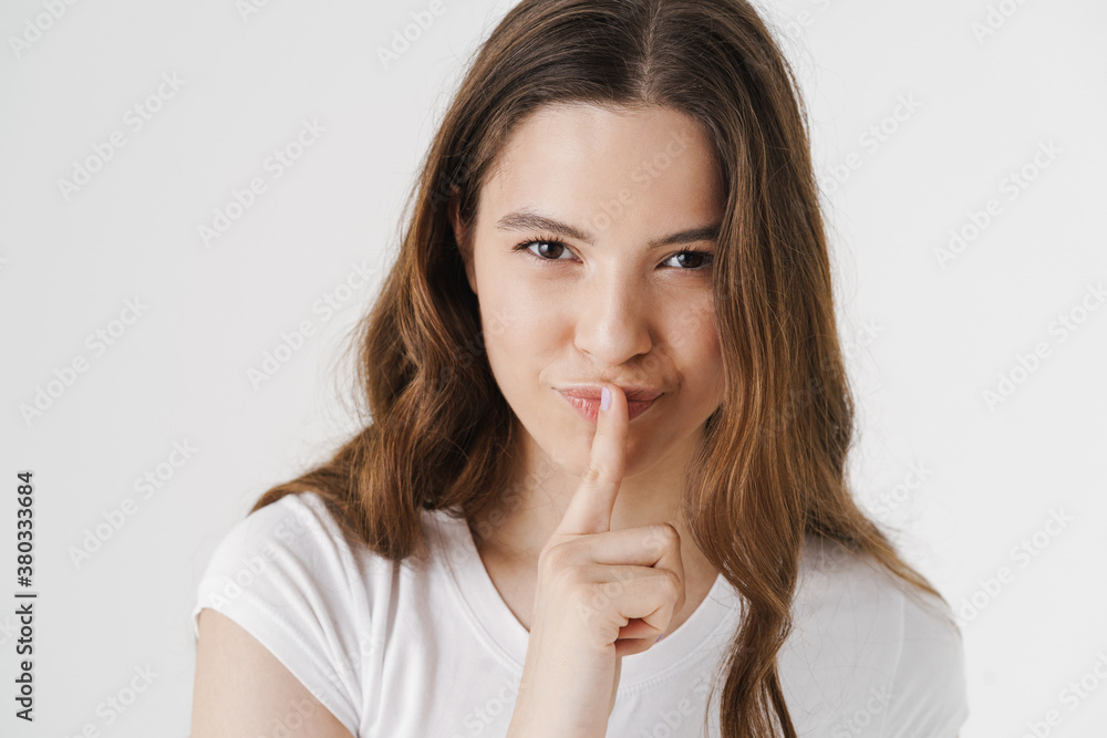 Portrait of a pretty young girl showing silence Portrait of a pretty young girl showing silence