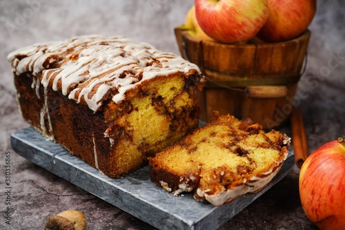Photography Homemade Apple Fritter Bread drizzled with white glaze on fall autumn background