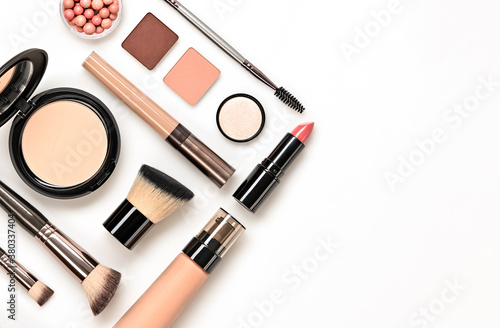 Beauty cosmetic makeup background. Fashion woman make up product, brushes, lipstick, nail polish layout. Creative pink concept. Cosmetology nude make-up accessories, top view.