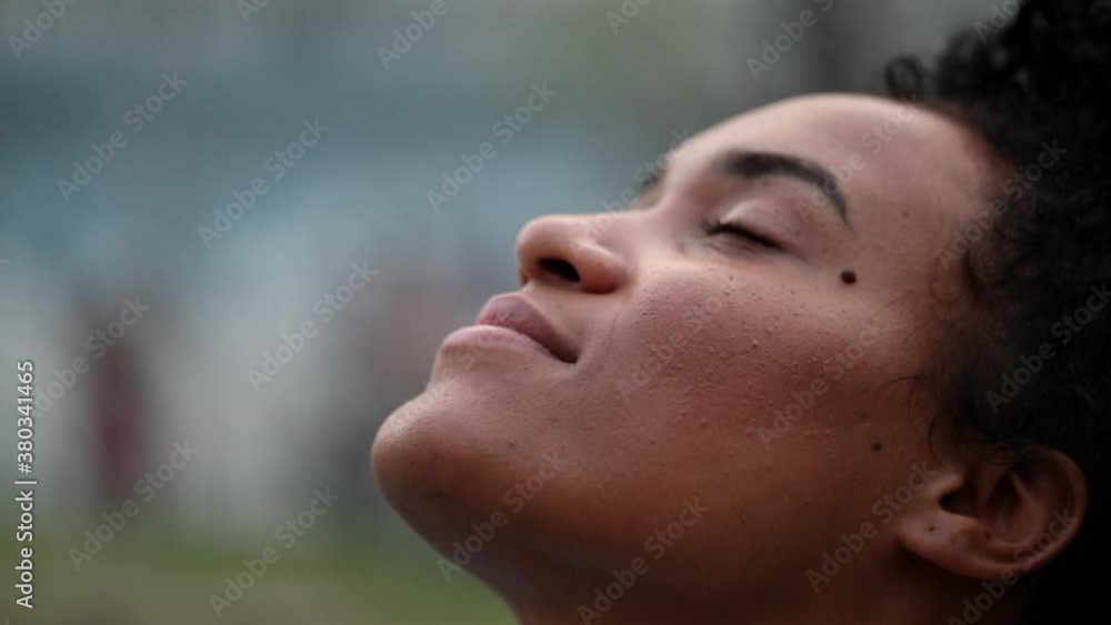 African woman face looking at sky