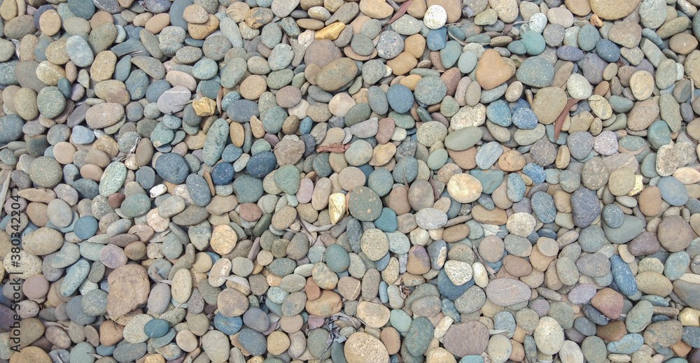 abstract background with dry round reeble stones, stone background, cobblestone. abstract background with dry round reeble stones, stone background, cobblestone.