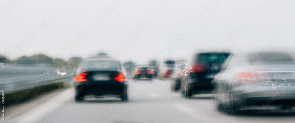 Blurred Cars in Motion on a Highway Blurred Cars in Motion on a Highway