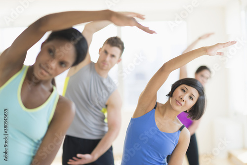 People stretching in gym photo