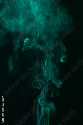 Turquoise smoke on black