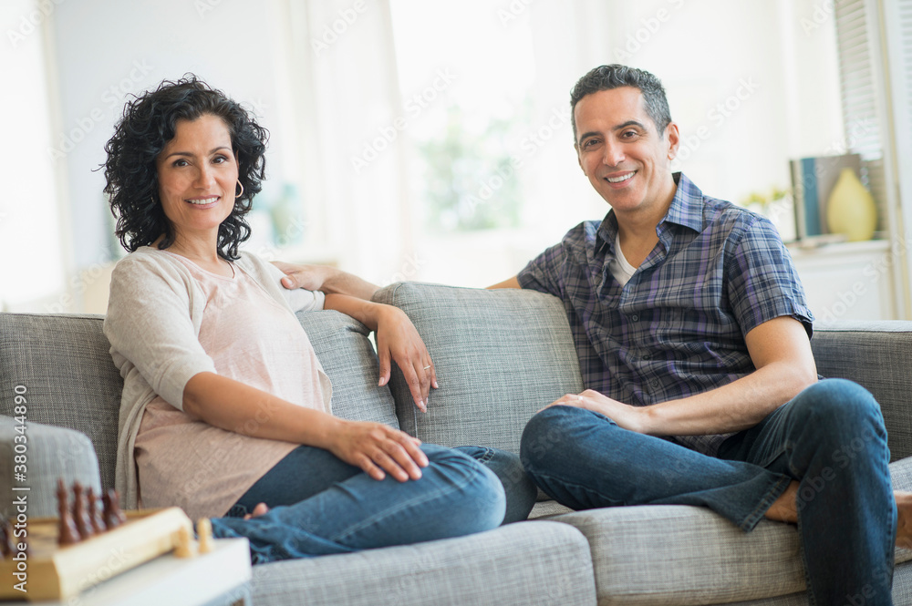Couple sitting on sofa Couple sitting on sofa