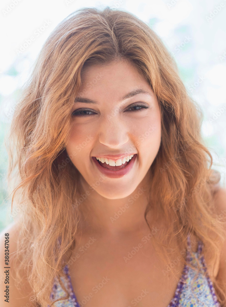 Portrait of young woman laughing Portrait of young woman laughing