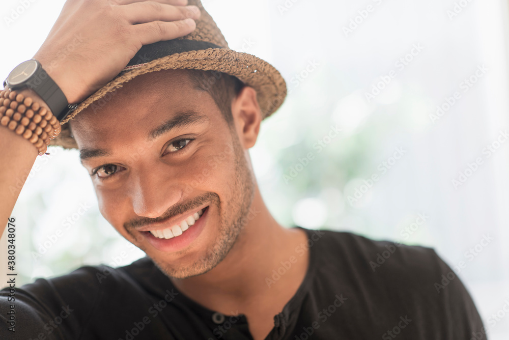 Portrait of smiling man in straw hat Portrait of smiling man in straw hat
