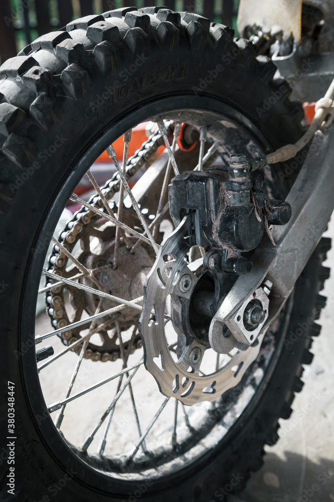 The rear wheel and brake system of the motorcycle.