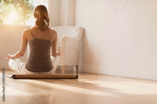 Young woman practicing yoga photo