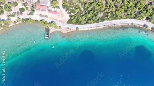 Aerial view of turquoise clear water and sandy beach of Ireon or Limni Vouliagmeni Lake in Peloponnese, Greece  photo