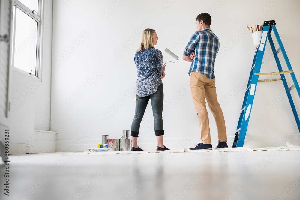 Couple painting room white
