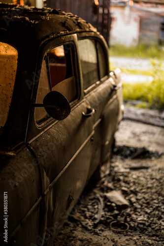 Side shot of an abandoned retro car photo