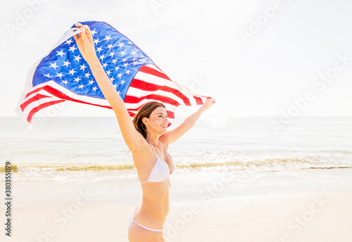 Woman holding American flag