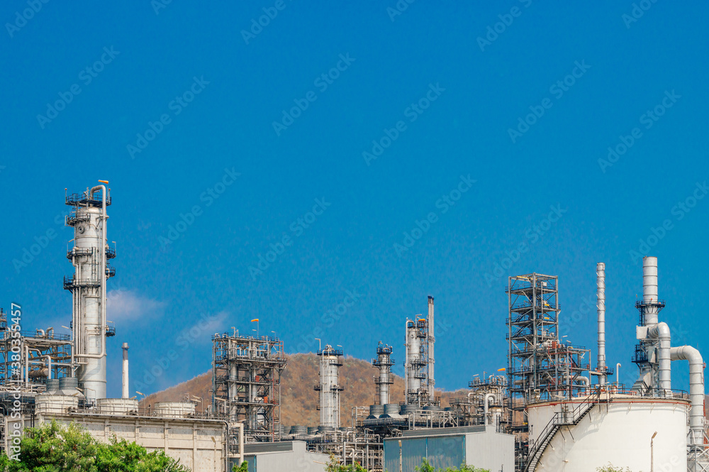 Fototapeta premium Industrial zone,The equipment of oil refining,Close-up of industrial pipelines of an oil-refinery plant,Detail of oil pipeline with valves in large oil refinery.