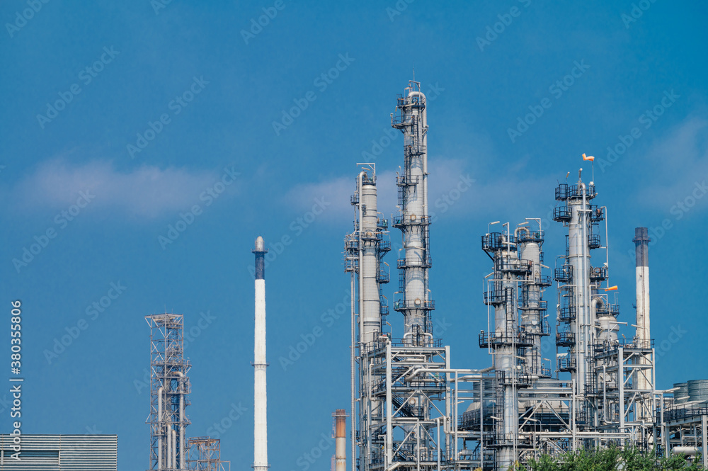 Fototapeta premium Industrial zone,The equipment of oil refining,Close-up of industrial pipelines of an oil-refinery plant,Detail of oil pipeline with valves in large oil refinery.
