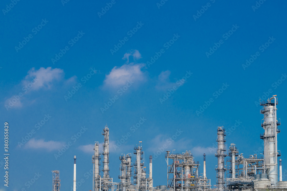 Fototapeta premium Industrial zone,The equipment of oil refining,Close-up of industrial pipelines of an oil-refinery plant,Detail of oil pipeline with valves in large oil refinery.