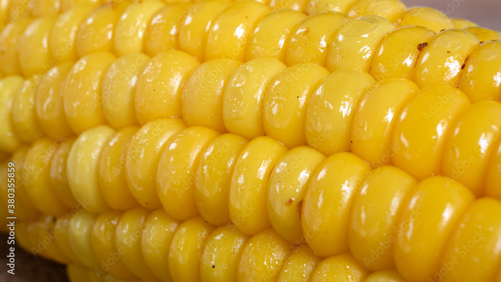 Delicious corn on the cob captured in an extreme close up. The brightly glowing yellow kernels form a recognizable pattern. The cob was lightly boiled and seasoned with salt.
Delicious corn on the cob captured in an extreme close up. The brightly glowing yellow kernels form a recognizable pattern. The cob was lightly boiled and seasoned with salt.