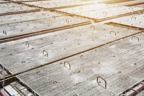 Precast concrete hard slab planks in formwork mold on the construction yard at construction site