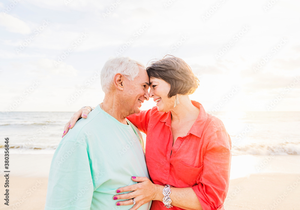 Older couple spending time together on beach Older couple spending time together on beach
