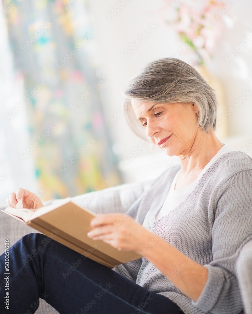 Portrait of woman reading on sofa Portrait of woman reading on sofa