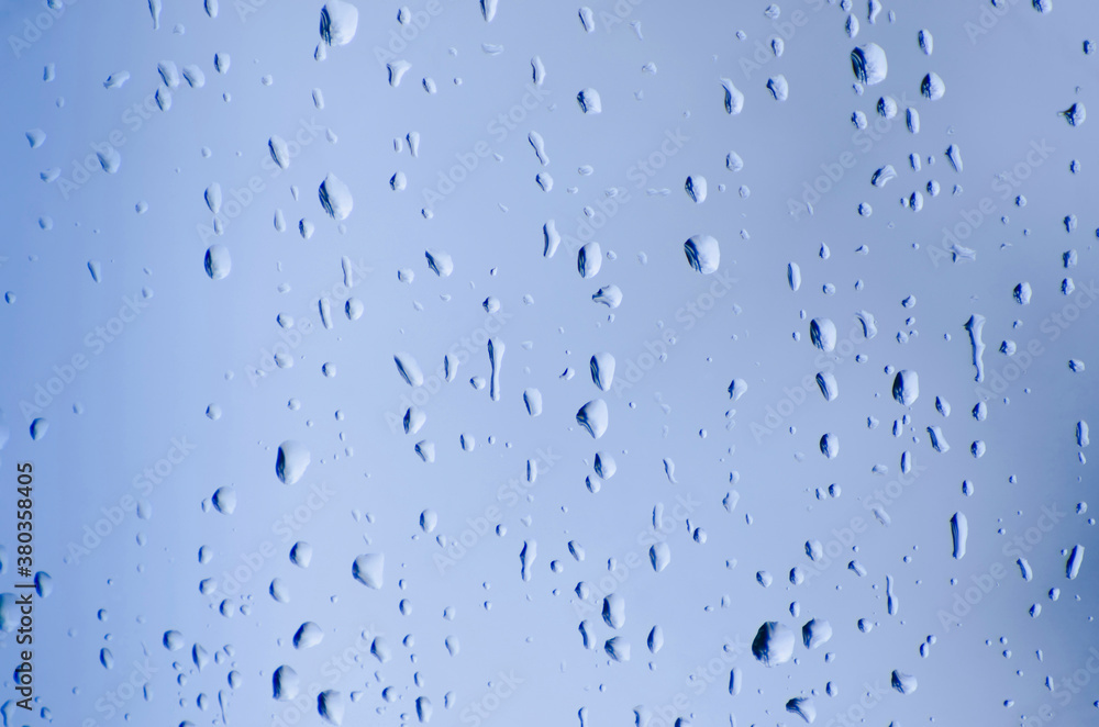 Studio shot of water drops on glass Studio shot of water drops on glass