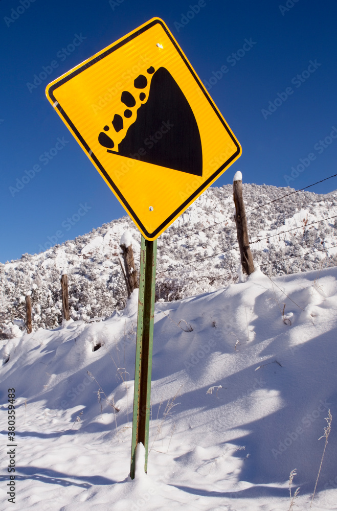 View of road sign and snowcapped mountain View of road sign and snowcapped mountain