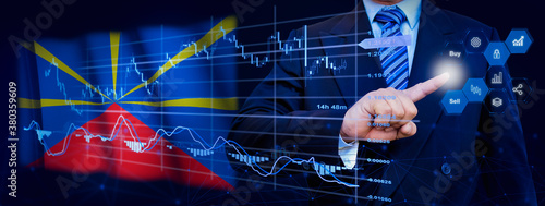 Businessman touching data analytics process system with KPI financial charts, dashboard of stock and marketing on virtual interface. With Reunion flag in background. © TexBr