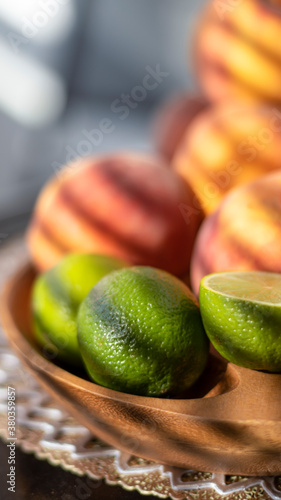 Fruit in a wooden bowl. Pea...