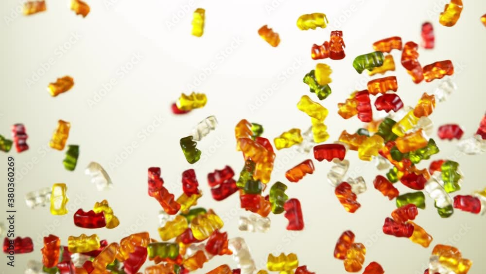Super slow motion of flying gummy bears up in the air. Filmed on high speed cinema camera, 1000 fps. Super slow motion of flying gummy bears up in the air. Filmed on high speed cinema camera, 1000 fps.