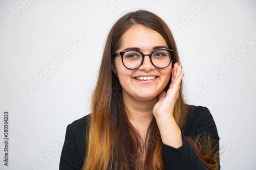 Happy girl showing thubs up. Closeup Portrait child smiling isolated on grey