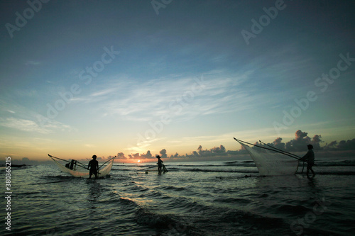 Nam Dinh  VIETNAM - August 1  . Fishermen working in the fishing village of Hai Hau  Vietnam on August 1  2014 in Hai Hau district  Nam Dinh .