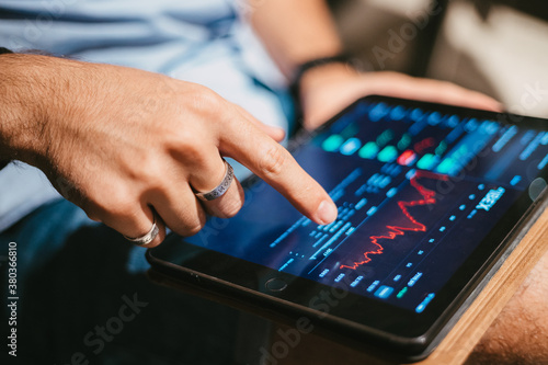 business man touching a tablet screen. stock market.