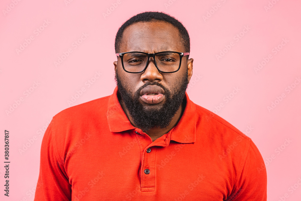 Thinking black Afro American man with serious expression looking, posing isolated against pink background. Thinking black Afro American man with serious expression looking, posing isolated against pink background.