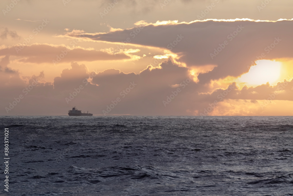 Oil tanker at sunset