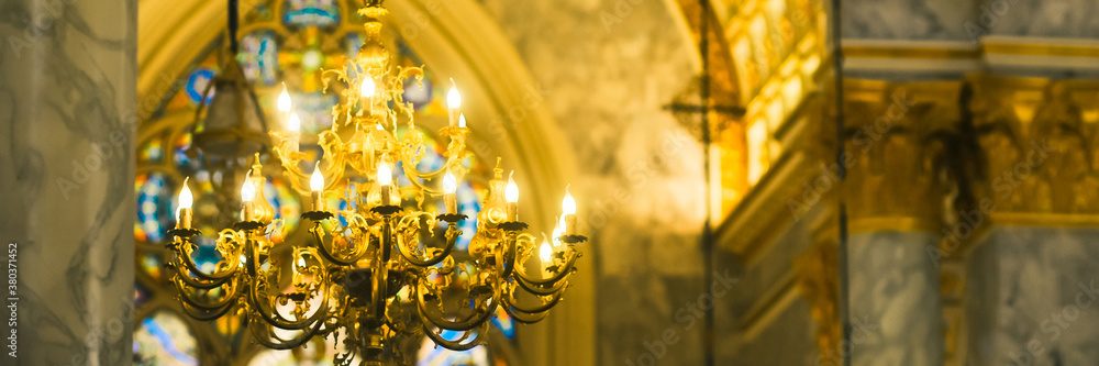 Fototapeta premium Elegant Lamp Hanging in the Church. Selective focus.