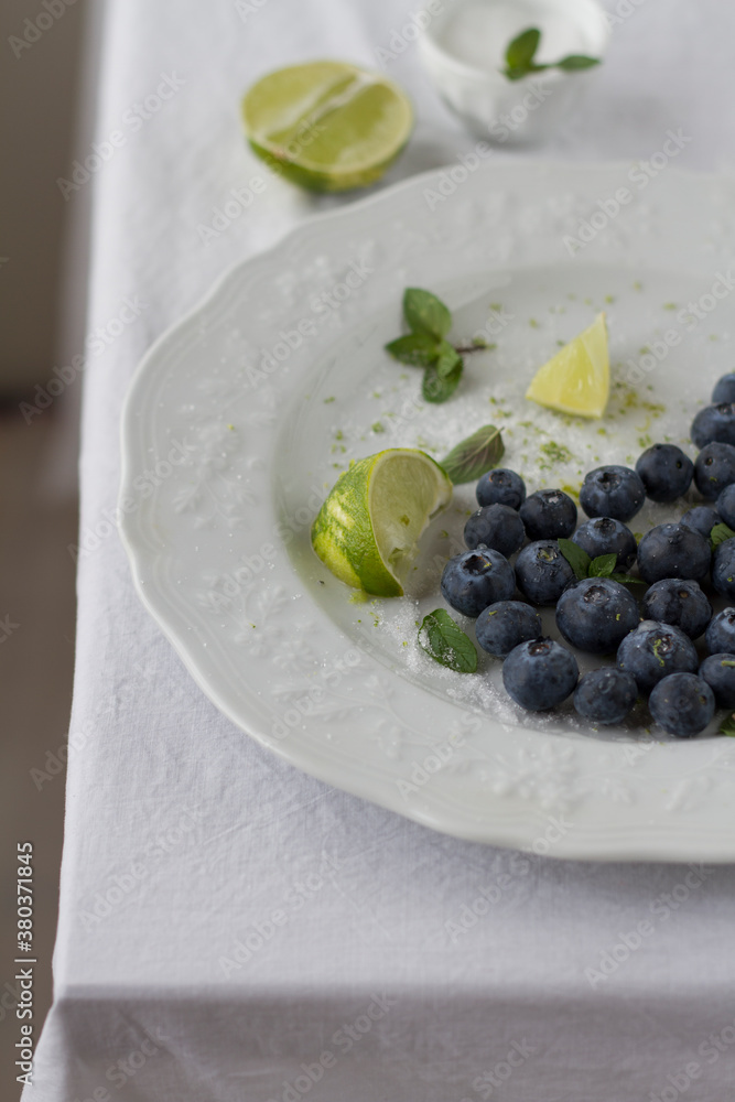 Blueberries with lime, sugar and mint leaves Blueberries with lime, sugar and mint leaves