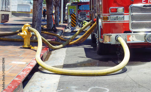 Canvas Print Fire truck hooked up to a hydrant.
