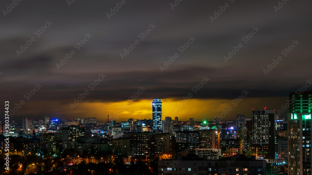 Vysotsky building in Yekaterinburg on the background of storm clouds at night 4