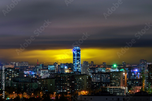 Vysotsky building in Yekaterinburg on the background of storm clouds at night 5