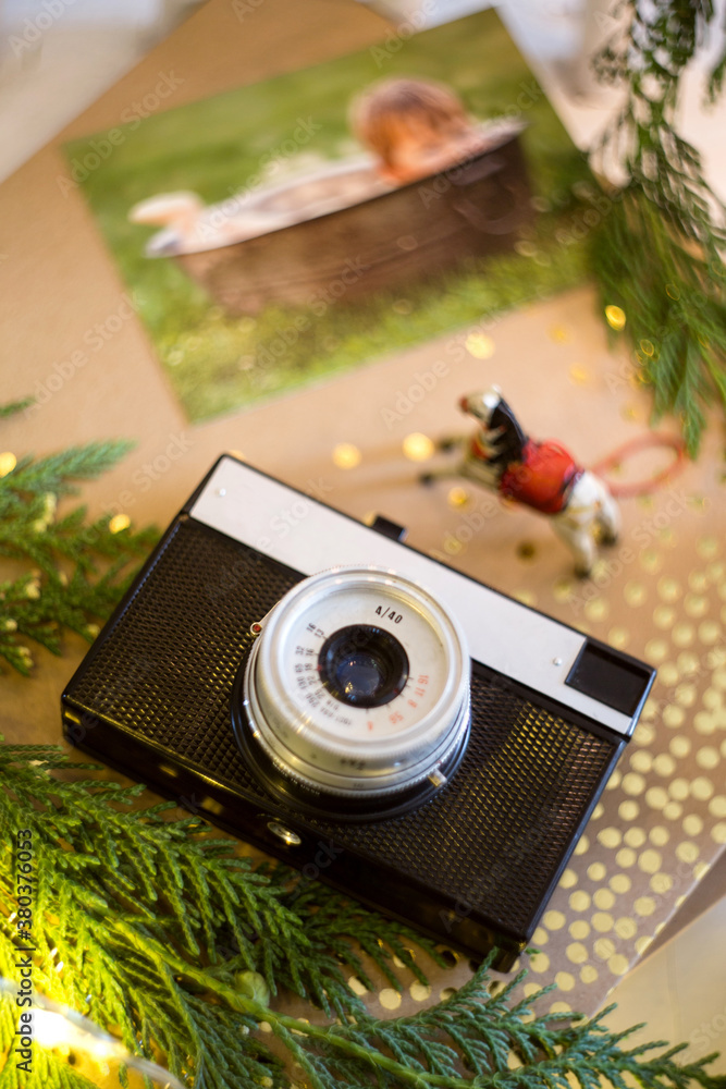 retro analog photo camera in Christmas scenery.