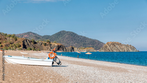 Fototapeta Naklejka Na Ścianę i Meble -  Natural beach of Turkish Riviera with boats in Cirali, Antalya Province, Turkey, Asia