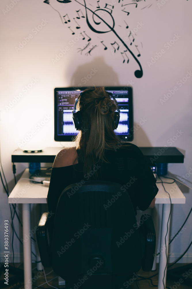 Woman Producing Music in Her Home Sound Studio Woman Producing Music in Her Home Sound Studio