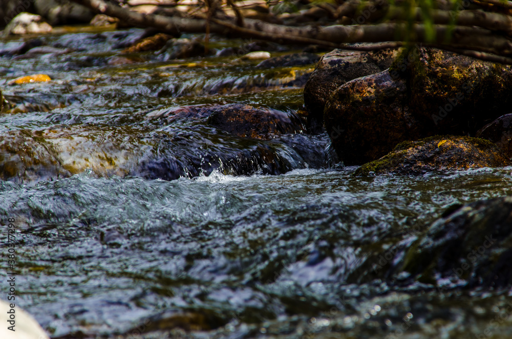 in summer rocky mountain river water silk. mountain river in summer rocky mountain river water silk. mountain river