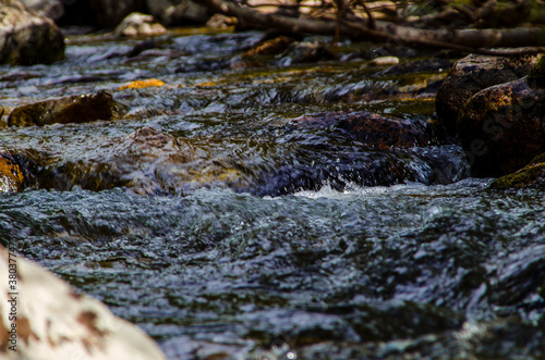 in summer rocky mountain river water silk. mountain river © efimenkoalex