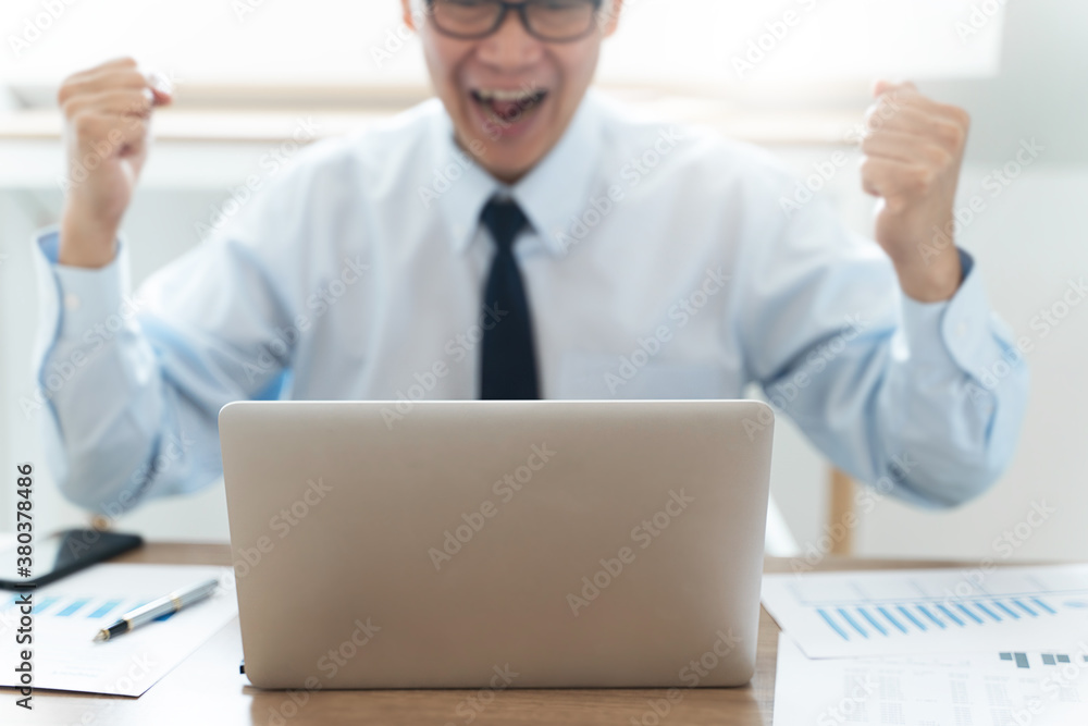Happy mature businessman smiling watching on laptop. Happy mature businessman smiling watching on laptop.