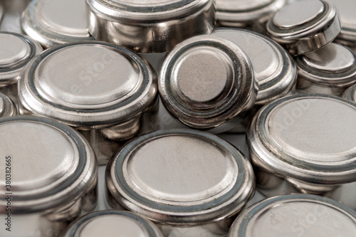 Obraz na płótnie Watch repair and watchmaker replacing the battery concept with macro close up photograph of a heap of lithium button cell batteries w salonie
