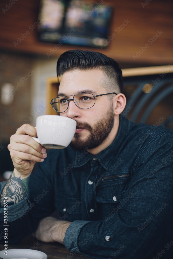 Stylish young man drinking coffee Stylish young man drinking coffee